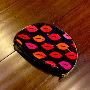 Small black makeup back with lip kiss print.
